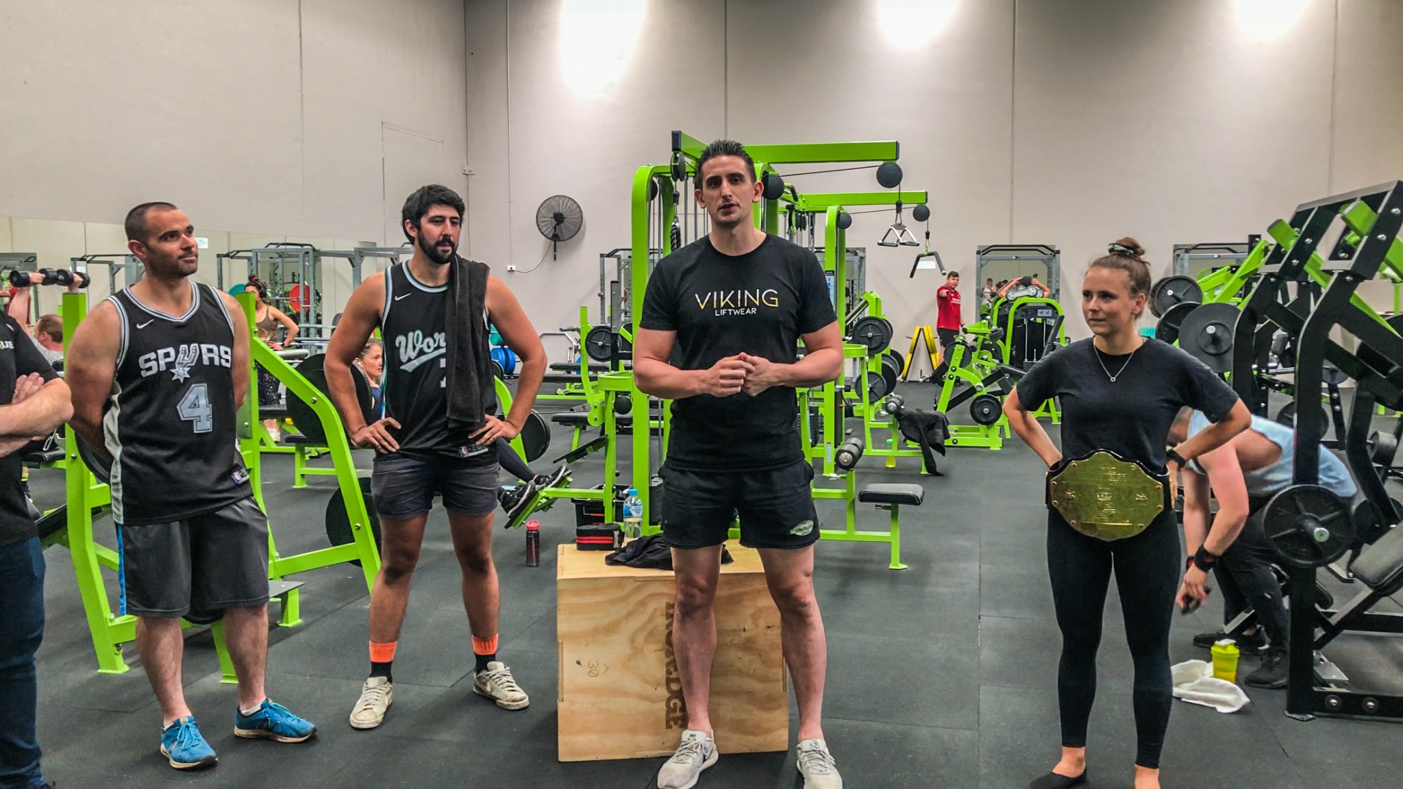 Sean Currey talking with clients in the gym